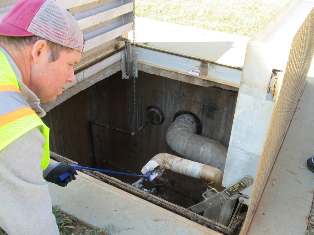 Project Manager working in the field conducting a TSI Sampling