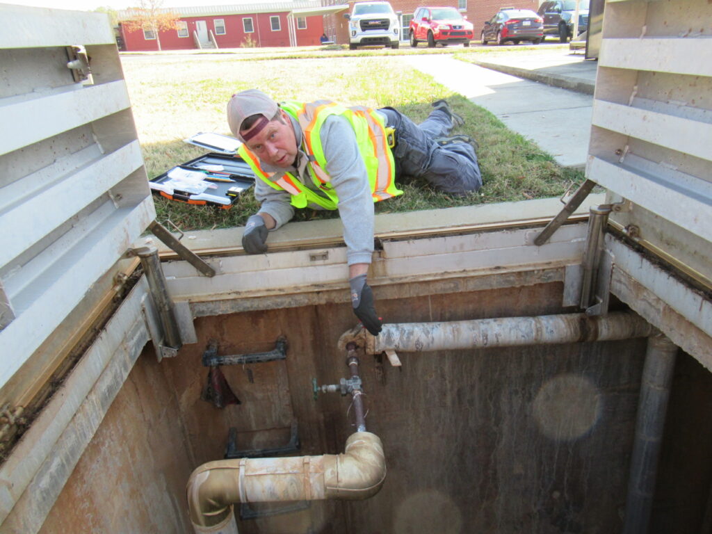 Project Manager working in the field conducting a TSI Sampling